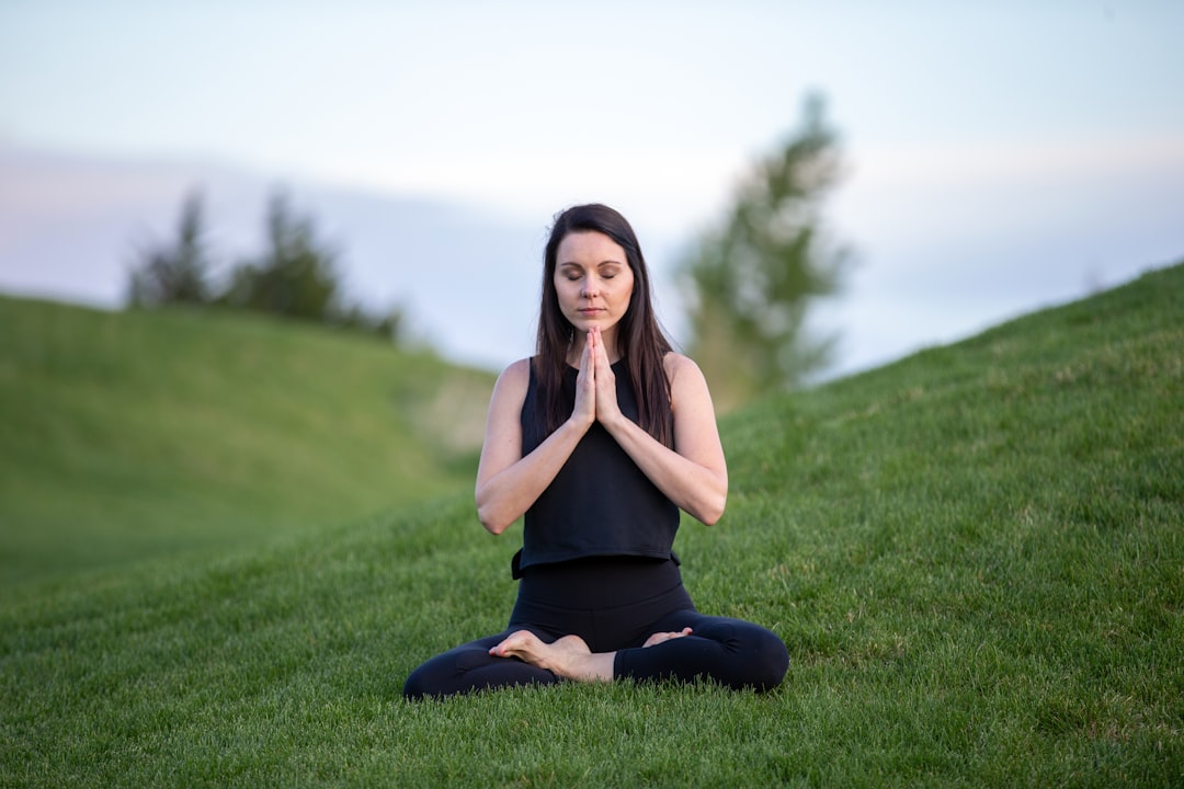 serene woman practicing yoga outdoors