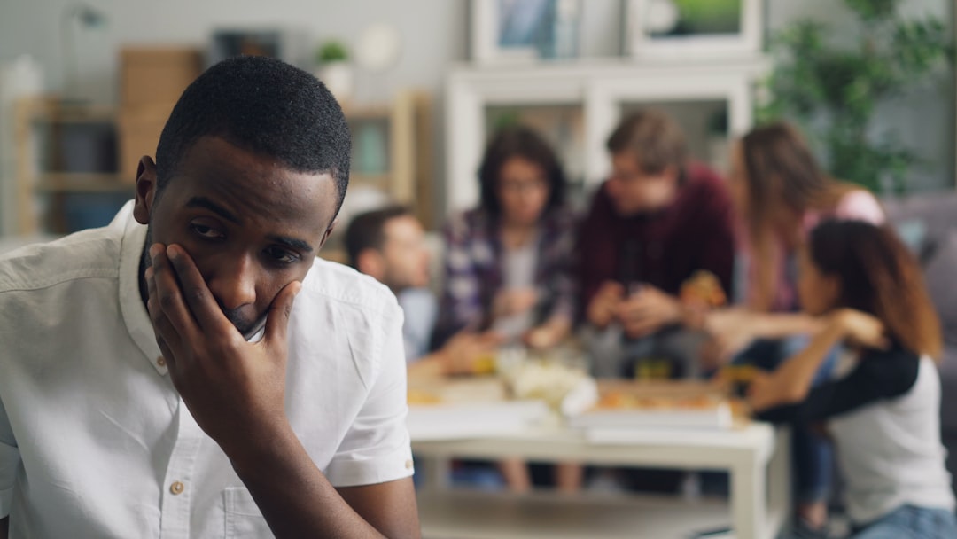person looking bored at social gathering