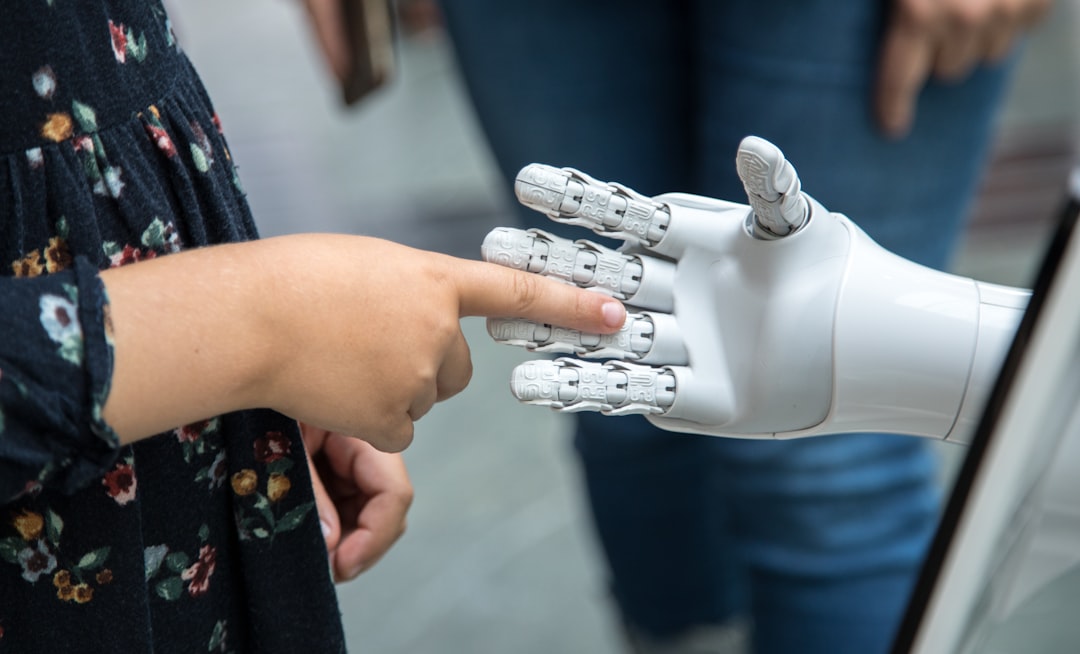 robot hand shaking human hand